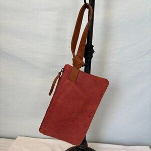 ABLE Rachel red leather wristlet with tan leather strap